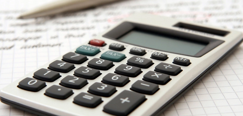 A calculator is shown with numbers on it.